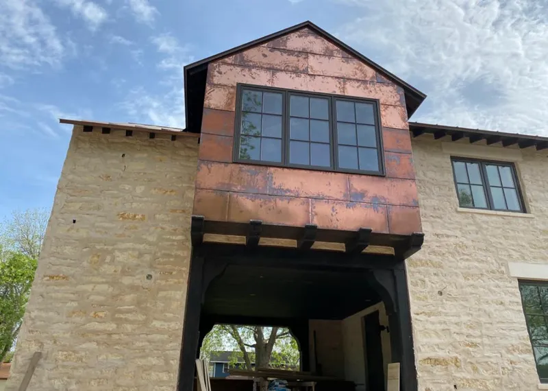 Copper metal panel facade on a stone building for Metal Roof Coating in West Hempfield
